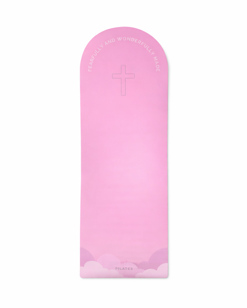Pink mat with an outline of the cross, cloud print and bible verse